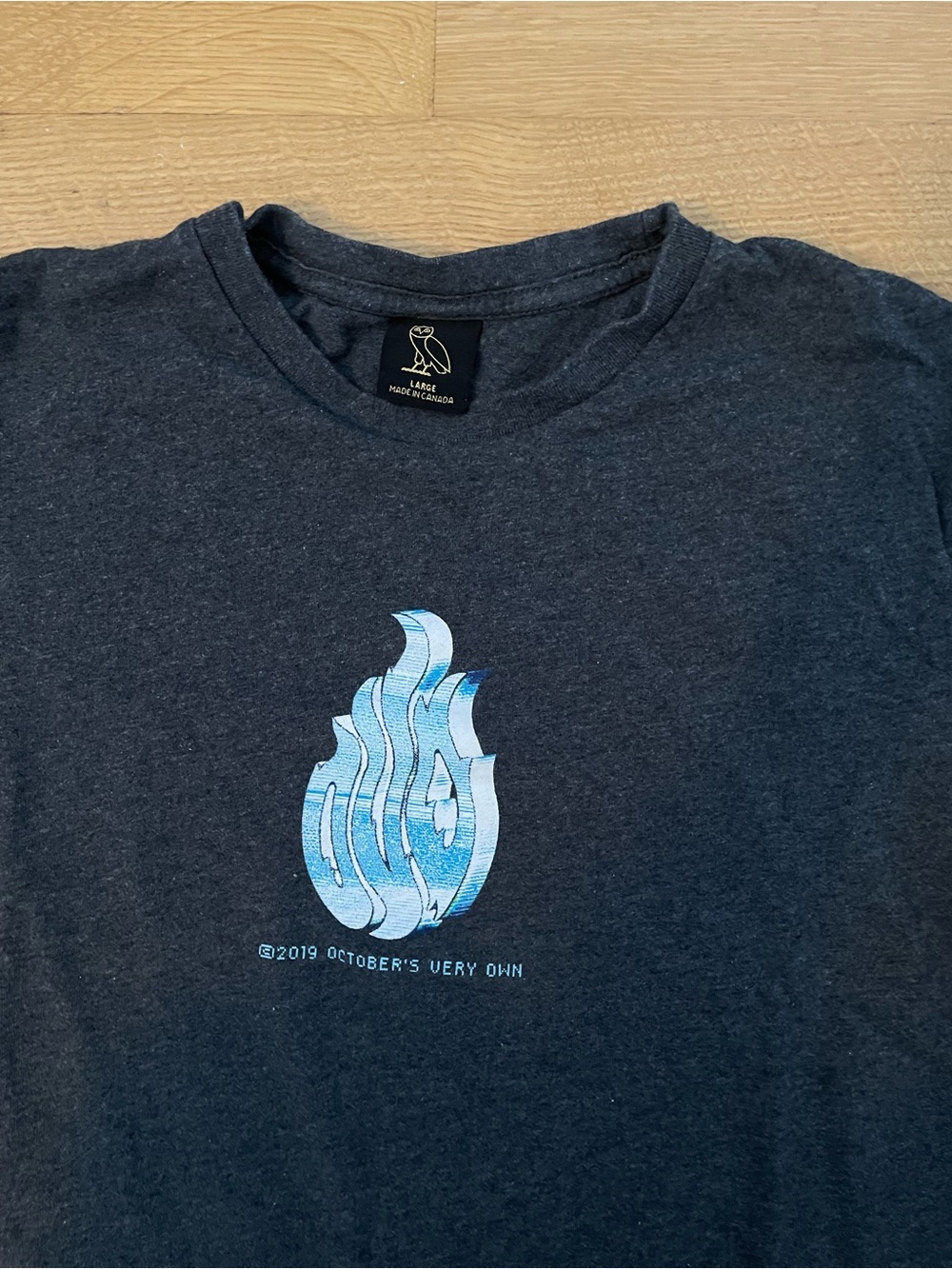 October's Very Own (OVO) Dark Grey Graphic Tee with Blue Flame Logo